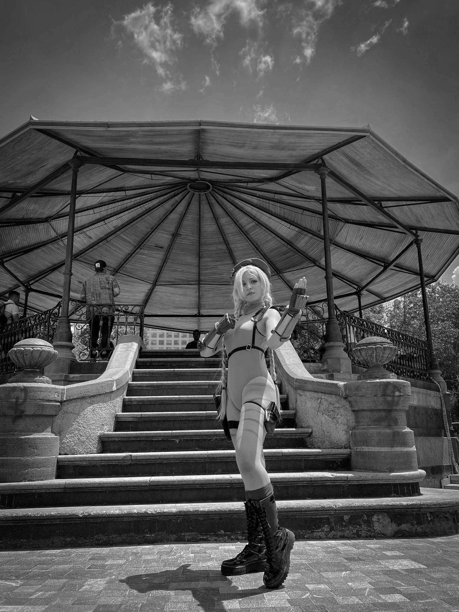 Cosplayer posing in front of a historic gazebo in Mexico City, showcasing detailed costume design.